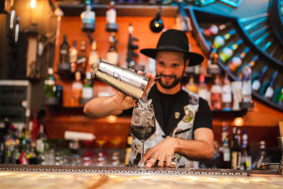 Paul Sfîrlea working behind a hospitality bar